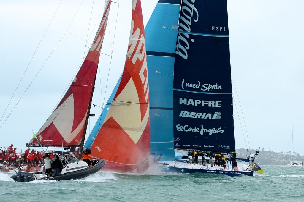 Camper in turn passes behind Telefonica at the next cross, accompanied by the ubiquitous TV boat- Volvo Ocean Race Auckland - Start March 18,2012 © Richard Gladwell www.photosport.co.nz
